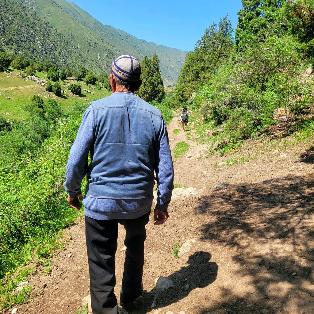 Local Kyrgyz man taking a hike through the valley