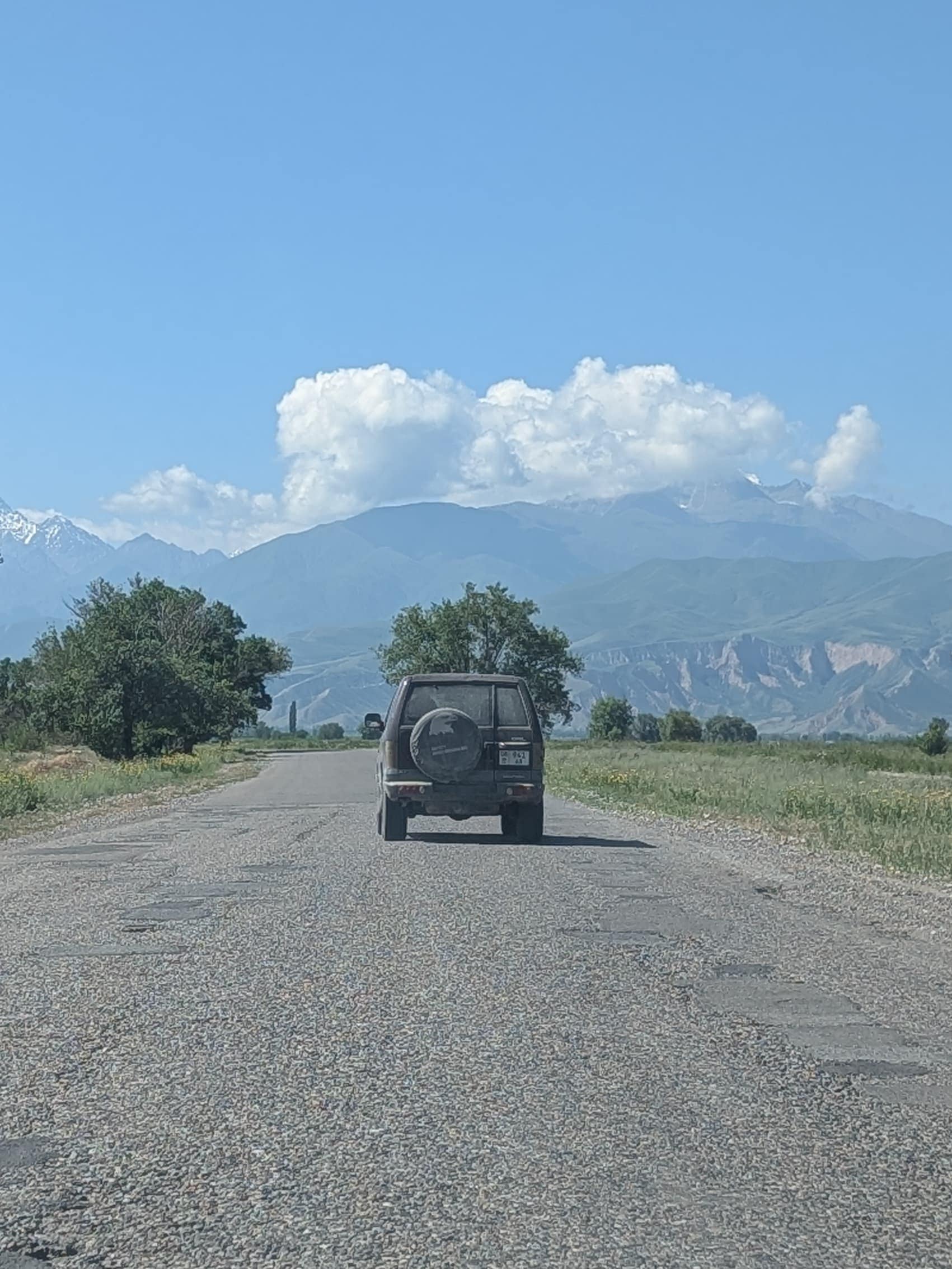 Driving towards mountains outside of Bishkek