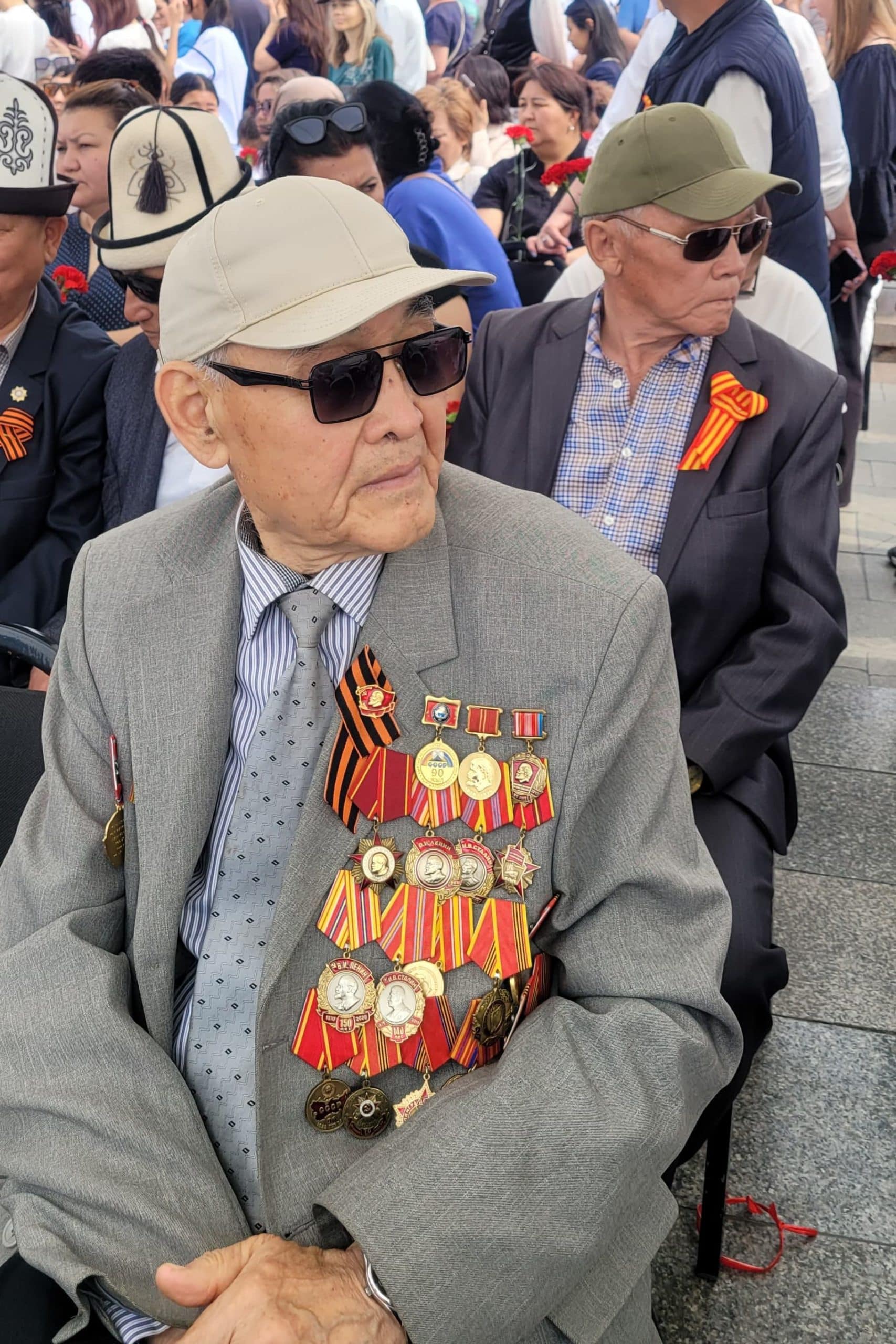WWII veteran watching Victory Day ceremony in Bishkek, Kyrgyzstan